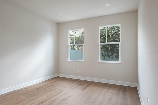 unfurnished room featuring light hardwood / wood-style flooring