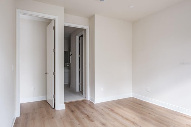 empty room with light hardwood / wood-style floors