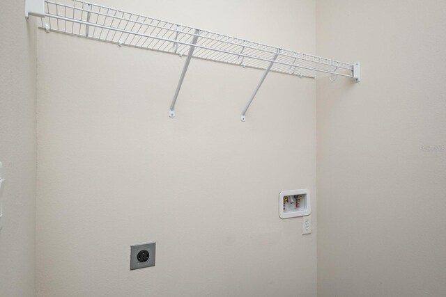 clothes washing area featuring washer hookup and hookup for an electric dryer