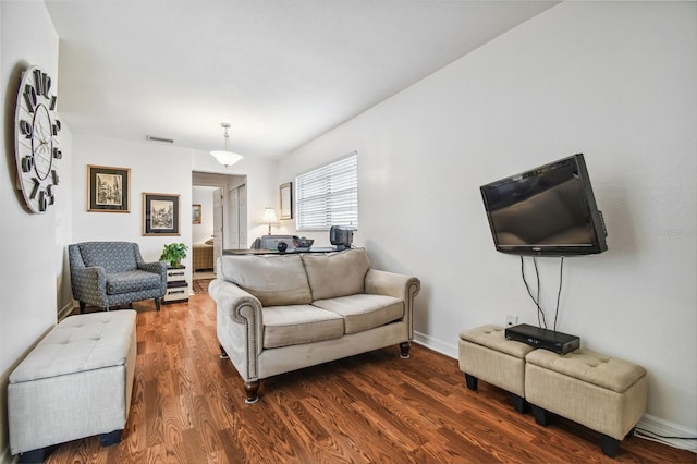 living room with dark hardwood / wood-style floors