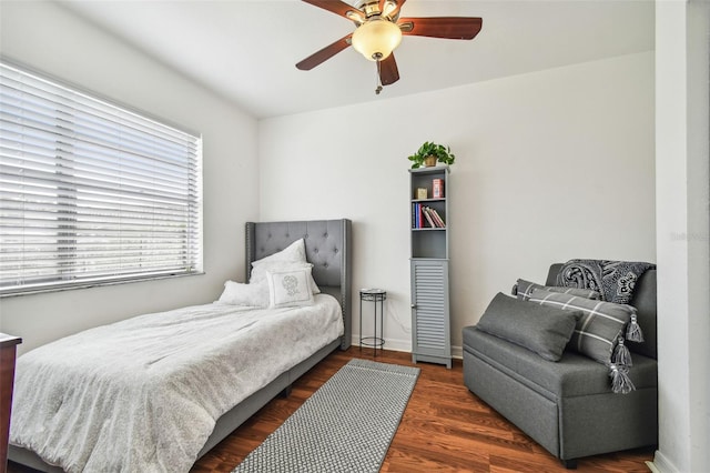 bedroom featuring ceiling fan and dark hardwood / wood-style flooring