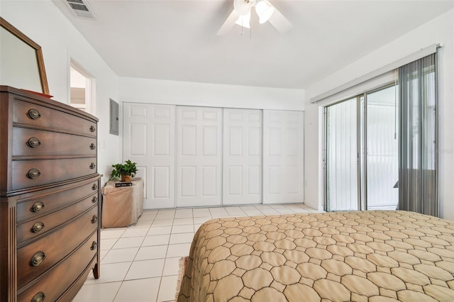 tiled bedroom featuring a closet and ceiling fan