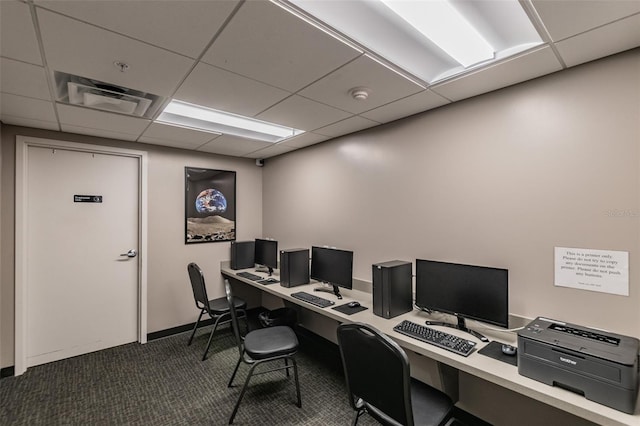 carpeted home office with a drop ceiling