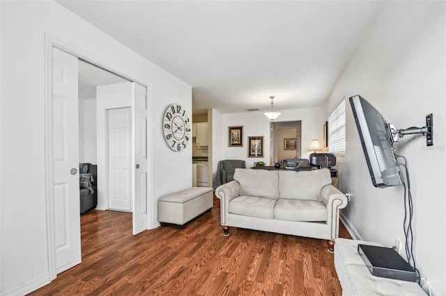 living room with dark hardwood / wood-style floors