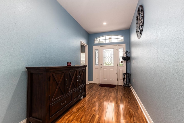 doorway to outside with dark wood-type flooring