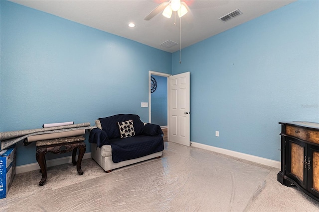 sitting room featuring ceiling fan