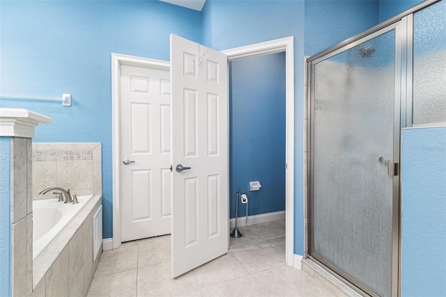 bathroom featuring tile patterned flooring and shower with separate bathtub