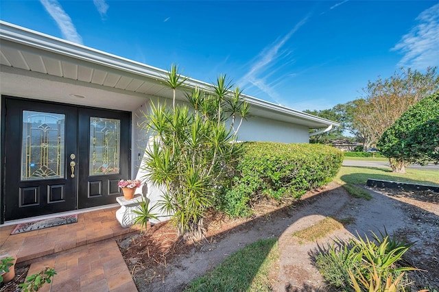 property entrance featuring french doors