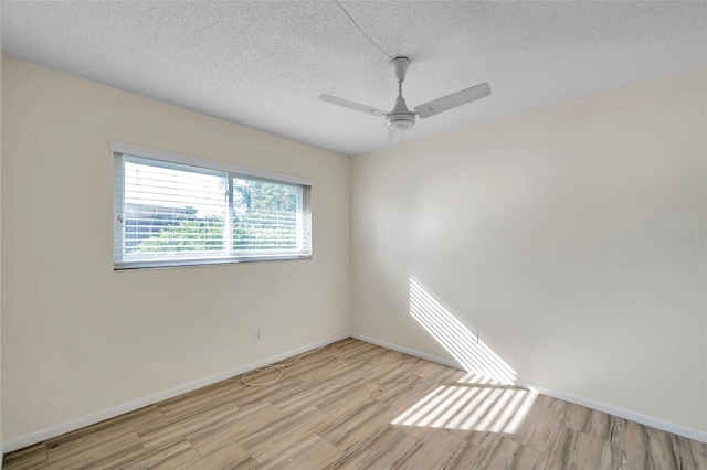 unfurnished room featuring a textured ceiling, ceiling fan, and light hardwood / wood-style flooring