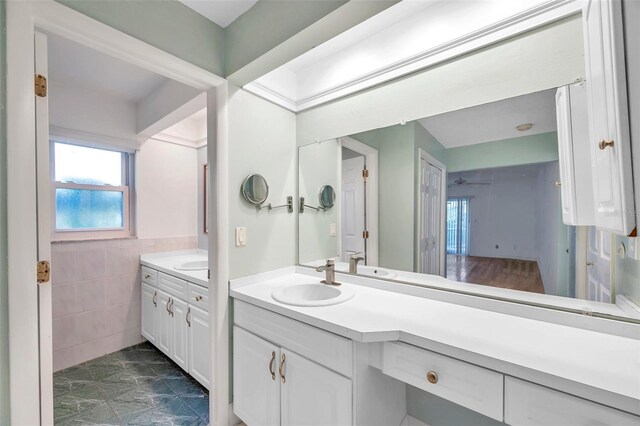 bathroom featuring tile walls, vanity, and tile patterned floors