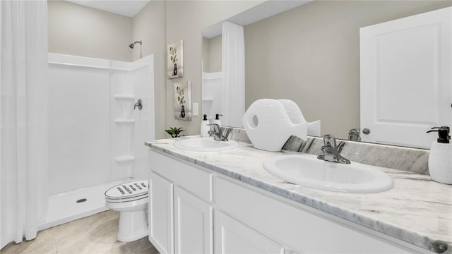 bathroom with toilet, a shower, vanity, and tile patterned flooring