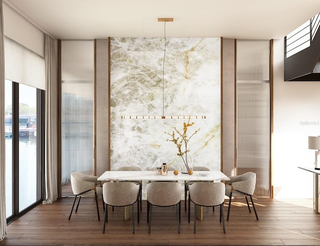 dining area featuring breakfast area, wood-type flooring, and a wall of windows