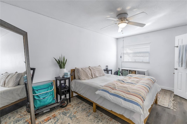 bedroom with hardwood / wood-style floors and ceiling fan