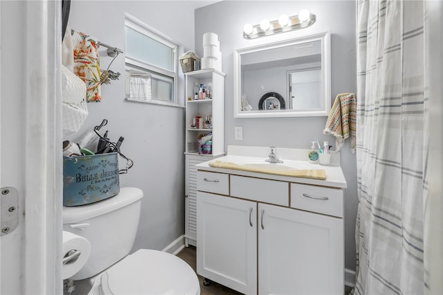 bathroom with vanity and toilet