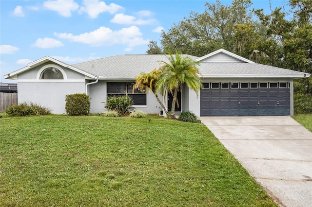 single story home featuring a garage and a front lawn