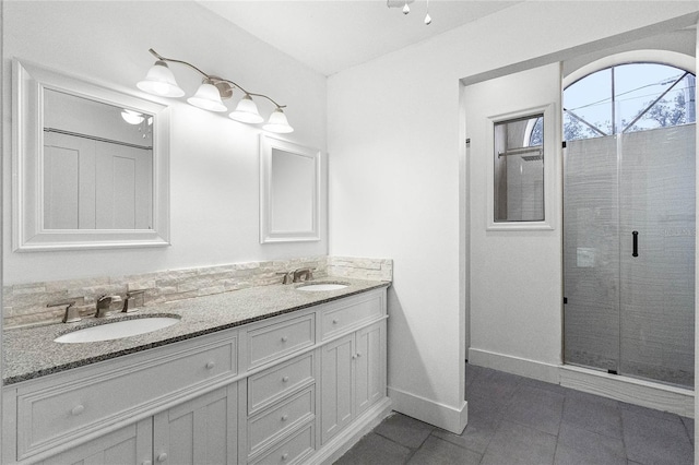 bathroom with vanity, tile patterned floors, and a shower with shower door