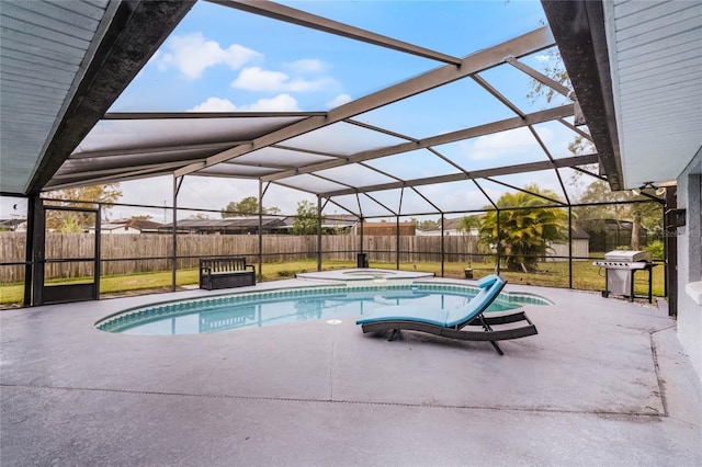 view of swimming pool with an in ground hot tub, a patio, glass enclosure, grilling area, and a yard