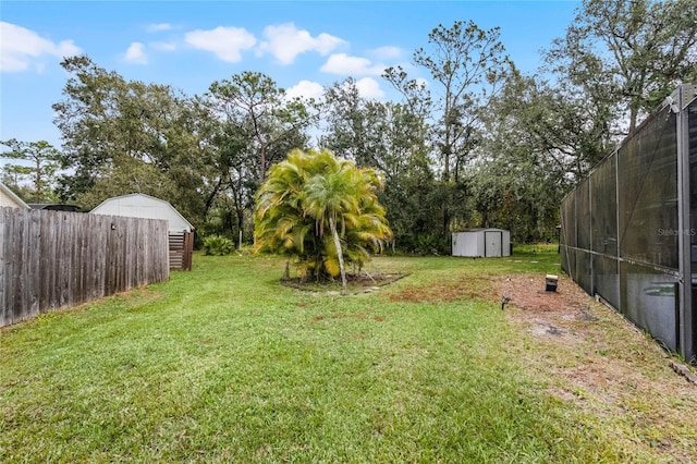 view of yard featuring a storage unit