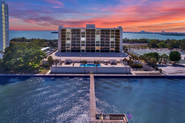 pool at dusk with a water view