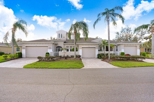 view of front facade with a garage and a front yard