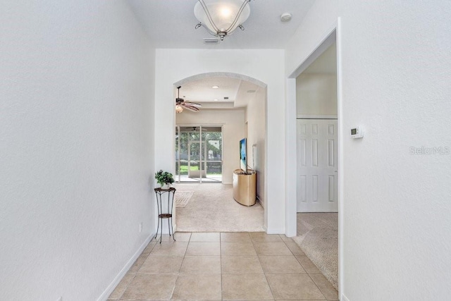 hallway with light carpet