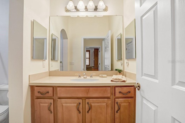 bathroom with vanity and toilet