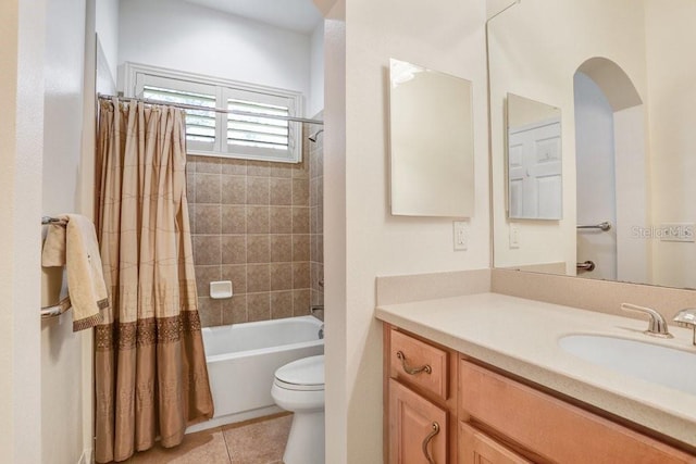 full bathroom featuring vanity, tile patterned flooring, toilet, and shower / bath combination with curtain