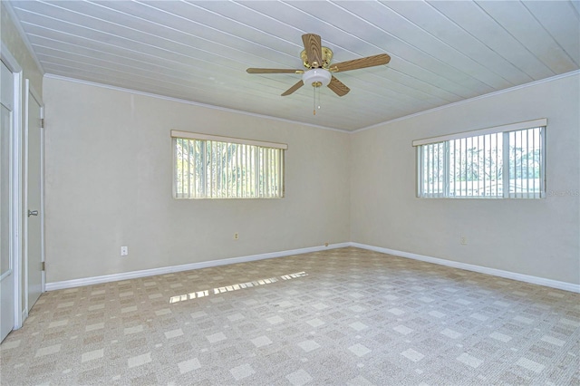 spare room with ornamental molding, ceiling fan, and wooden ceiling