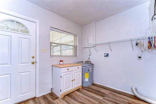 washroom with light wood-type flooring, washer hookup, water heater, and electric dryer hookup