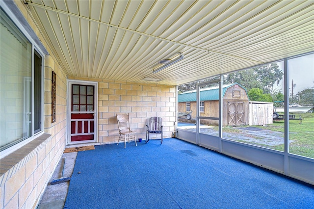 unfurnished sunroom featuring plenty of natural light