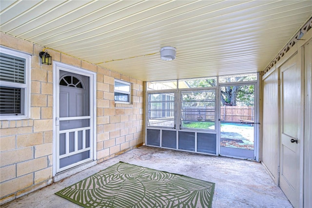 unfurnished sunroom featuring plenty of natural light