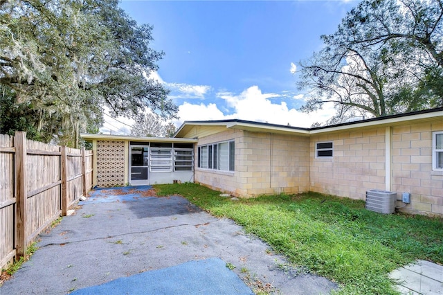 rear view of property featuring a patio area