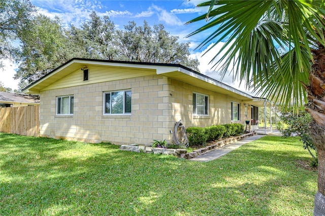 view of property exterior featuring a lawn