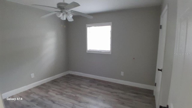 empty room featuring ceiling fan and light hardwood / wood-style floors