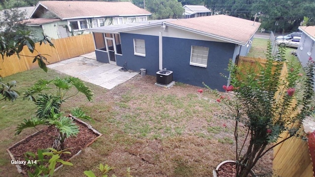 rear view of property with a patio area and central AC unit