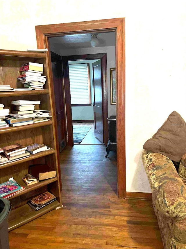 hallway featuring dark hardwood / wood-style floors