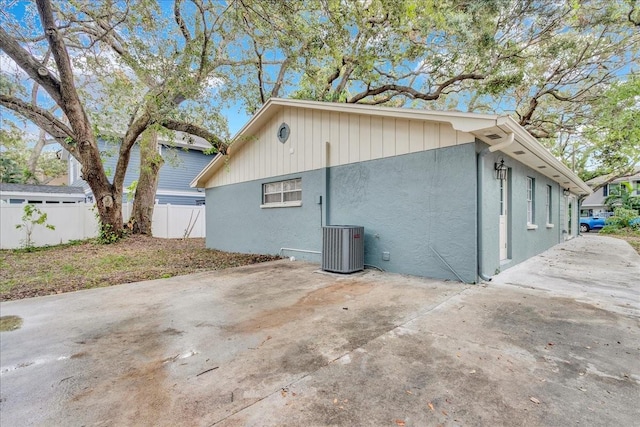 view of property exterior featuring a patio area and cooling unit