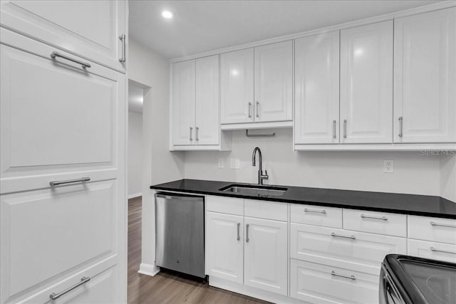 kitchen with white cabinetry, sink, range, dark wood-type flooring, and dishwasher