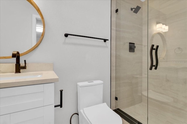 bathroom with a shower with shower door, vanity, and toilet