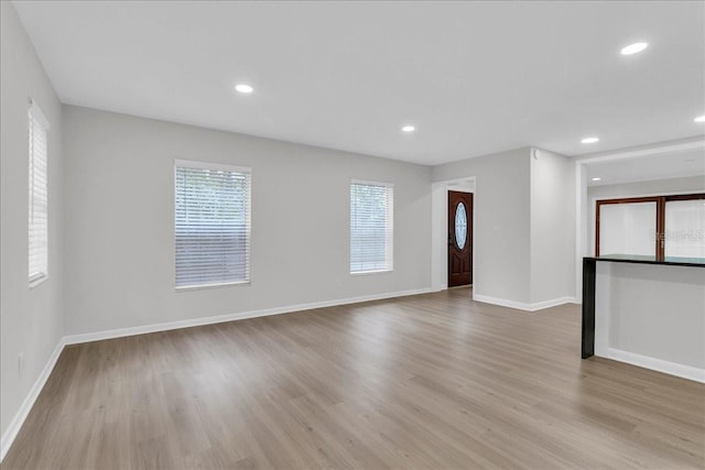 unfurnished room featuring light hardwood / wood-style flooring