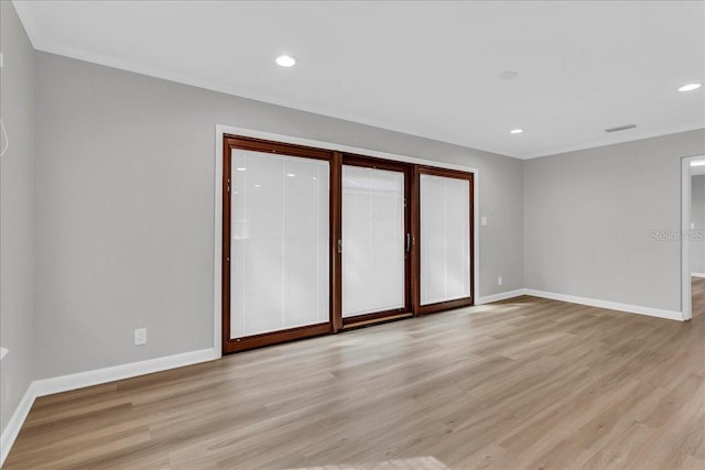 unfurnished room with light hardwood / wood-style flooring