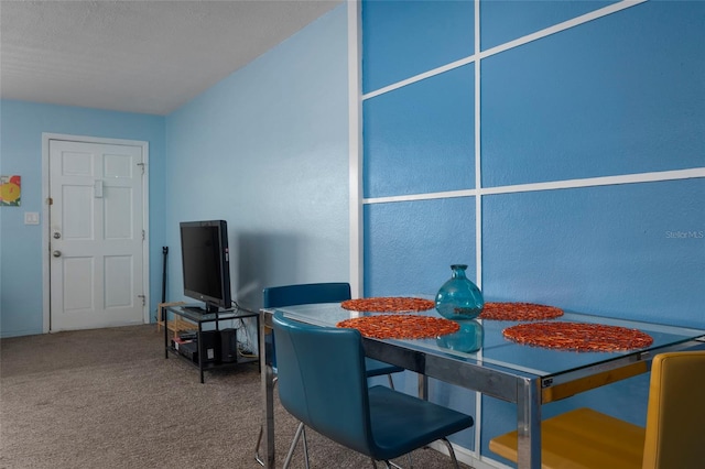 dining space featuring carpet floors