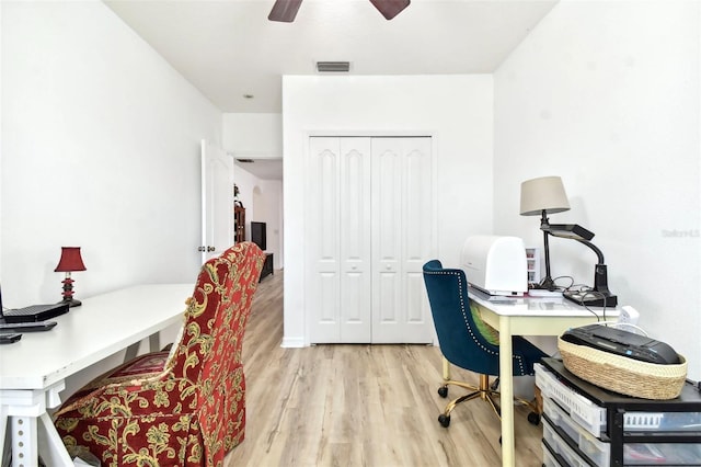 office space with ceiling fan and light hardwood / wood-style flooring