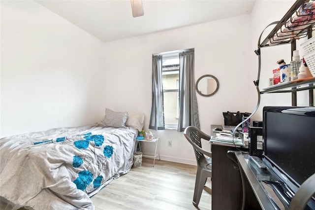 bedroom with ceiling fan and light hardwood / wood-style flooring