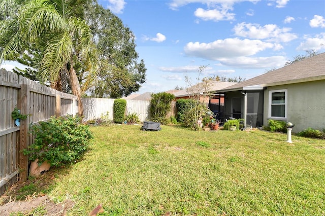 view of yard featuring a sunroom