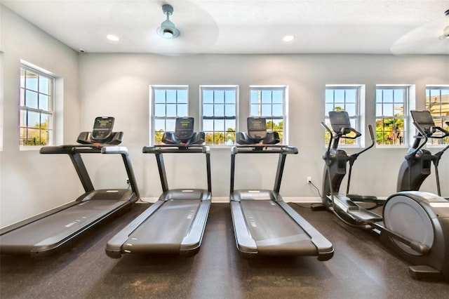 gym featuring a wealth of natural light and ceiling fan