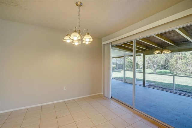 18138 Lake Worth Blvd, Port Charlotte, FL 33948 - empty room featuring a chandelier, light tile patterned floors, and baseboards
