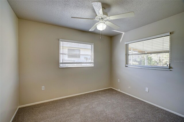 18138 Lake Worth Blvd, Port Charlotte, FL 33948 - carpeted empty room with a textured ceiling, baseboards, and ceiling fan