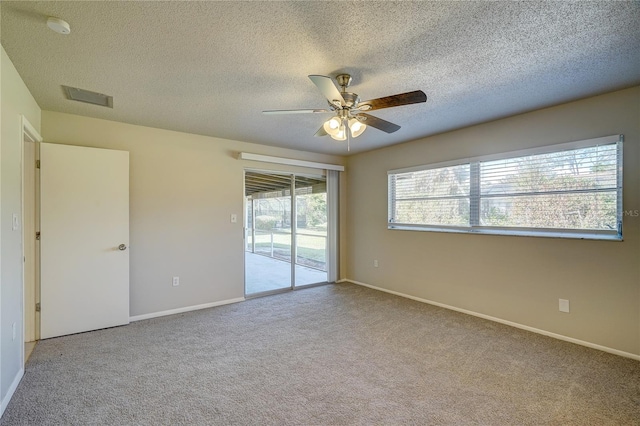 18138 Lake Worth Blvd, Port Charlotte, FL 33948 - carpeted spare room with a ceiling fan, a textured ceiling, a smoke detector, and baseboards