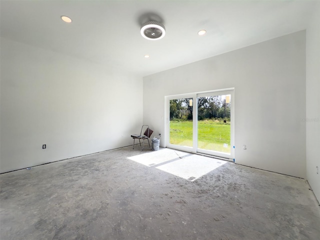 unfurnished room with concrete floors